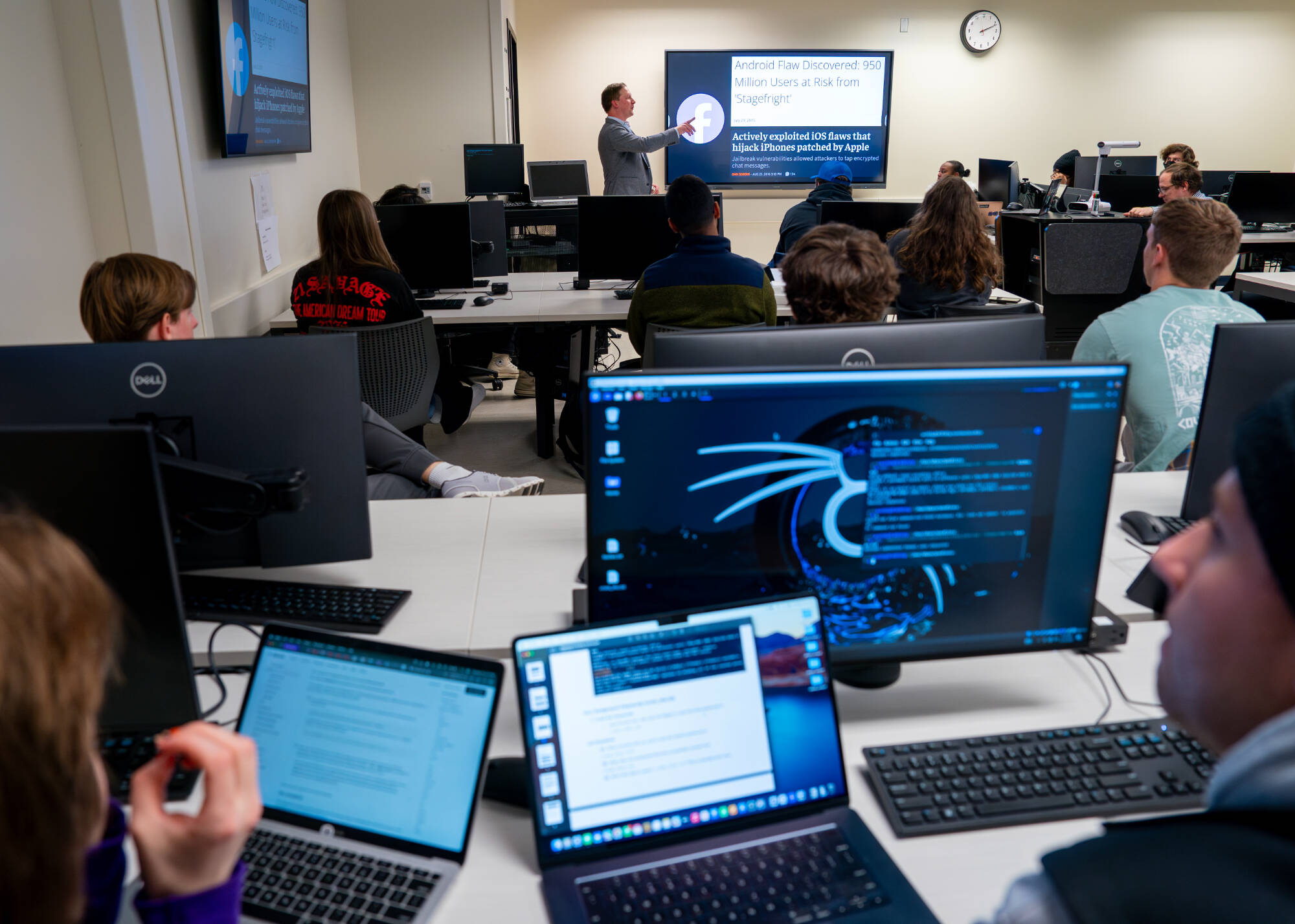 Josh Yavor speaks to students inside Andrew Kalafut’s  Introduction to Cybersecurity class (CIS 258) at Mackinac Hall on November 12. (Photo releases on file, including all students)